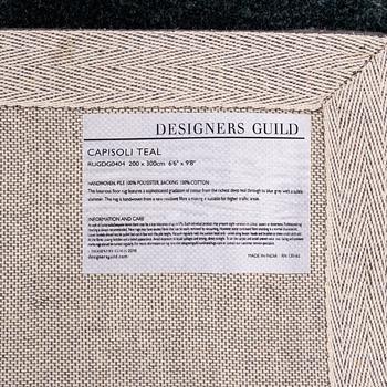 A Designers Guild carpet 'Capisoli teal', ca 205 x 300 cm.