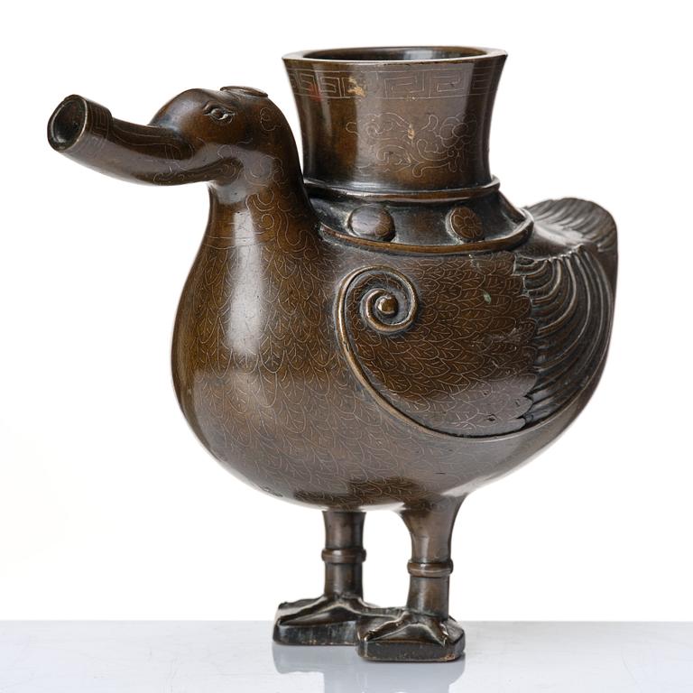 A bronze archaistic duck shaped vessel with silver inlay, Qing dynasty (1644-1912).