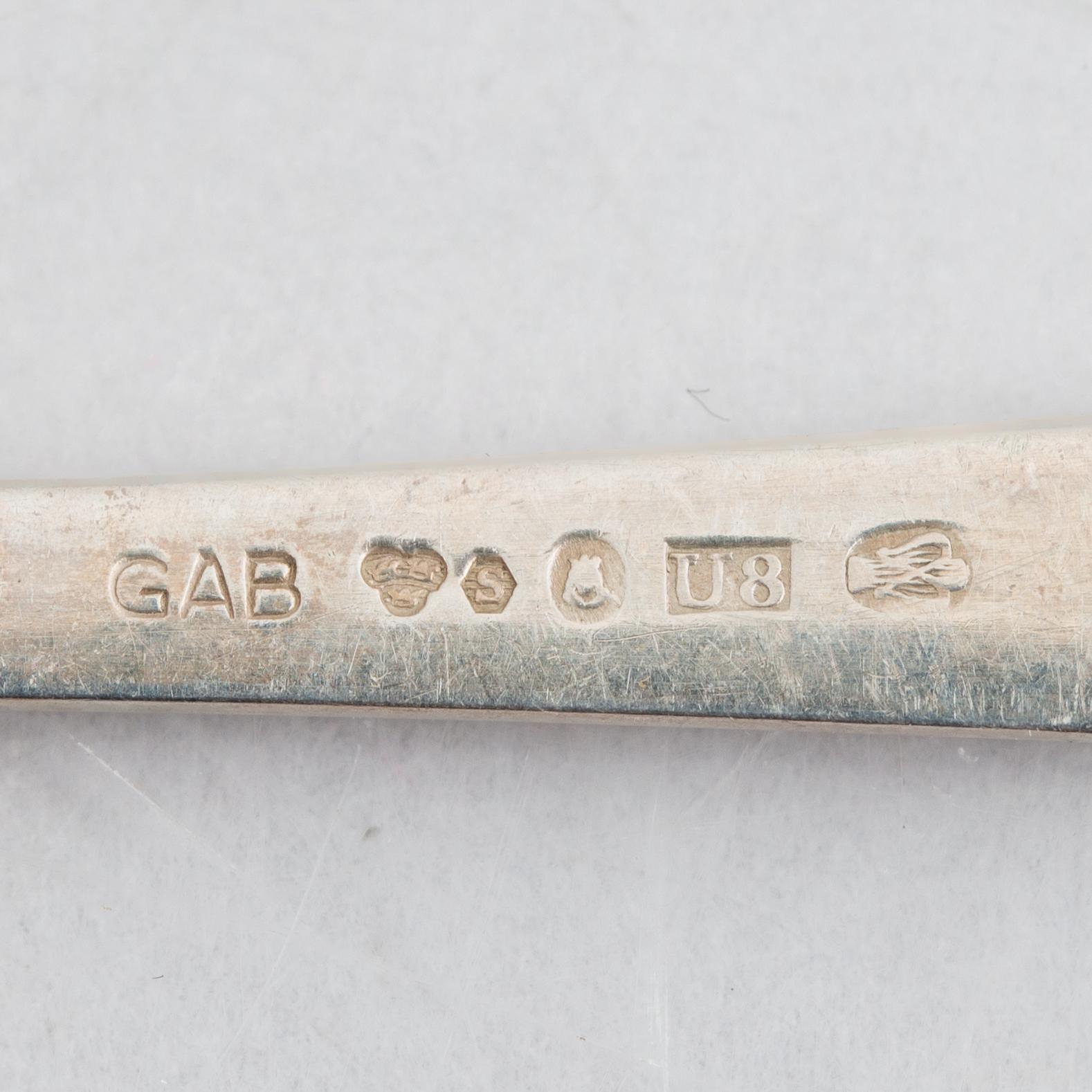 Jacob Ängman, 18 silver spoons, 'Rosenholm', GAB, Stockholm and Eskilstuna, 1943-91.