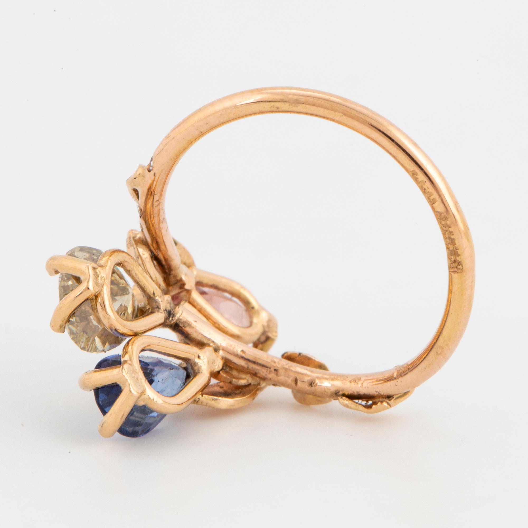 Heart shaped yellowgreen diamond, sapphire and pink tourmaline.