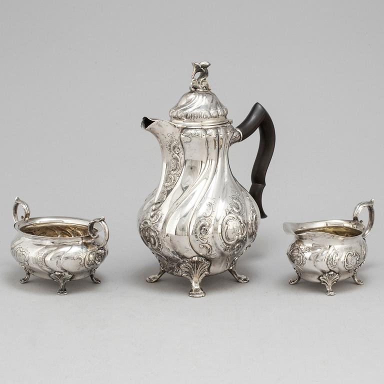 A three-piece silver rococo style coffee service by CG Hallberg, Stockholm, 1948.