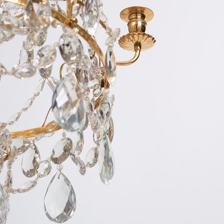 A Gustavian gilt-brass and cut-glass four-branch chandelier by O. Westerberg (master in Stockholm 1769-1881), dated 1795.