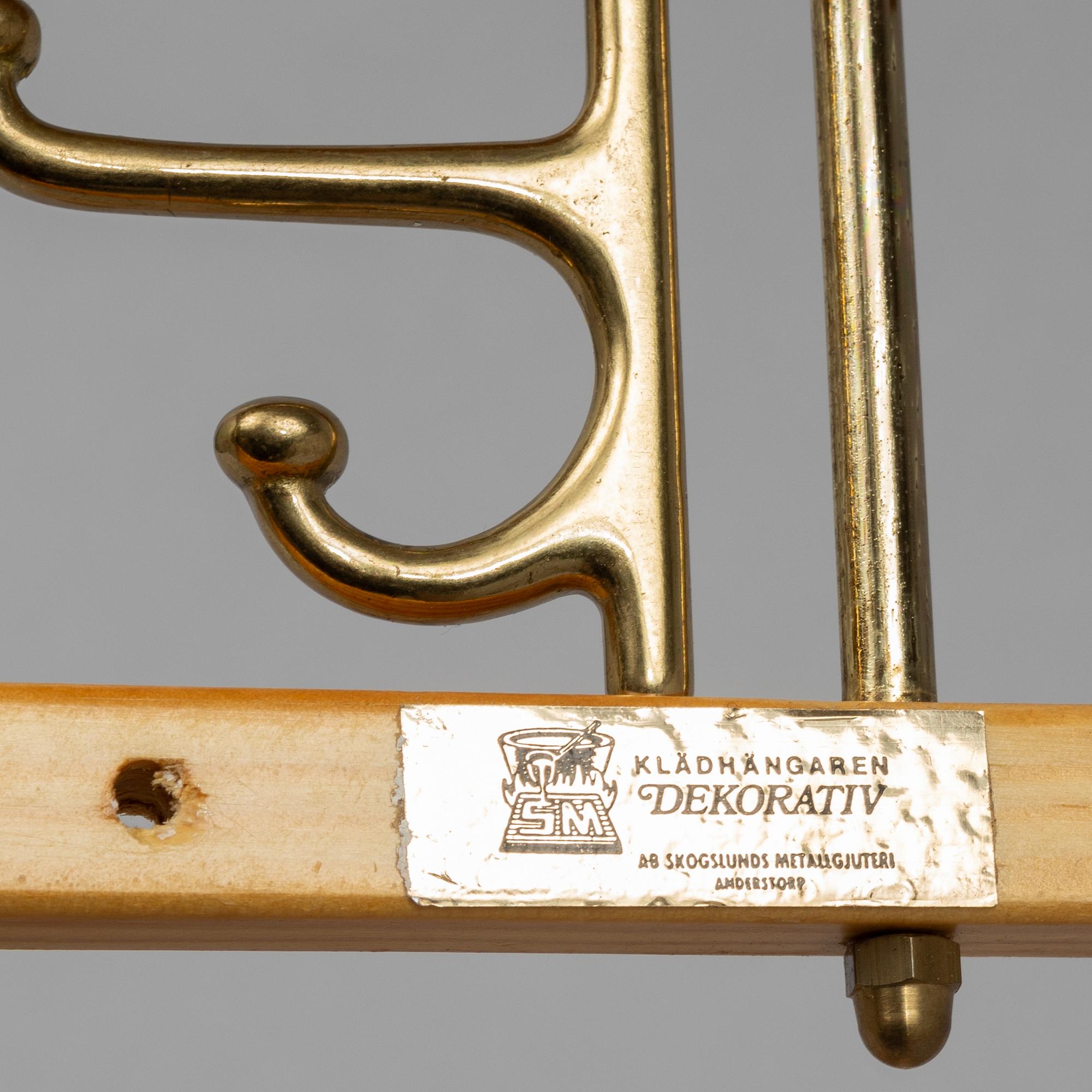 A set of three 'Dekorativ' coat hangers, Skoglunds metallgjuteri, Anderstorp, 1950s/60s.