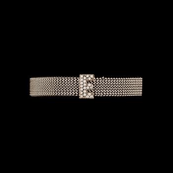 RANNEKORU, 18K valkokultaa, timantteja yht. n. 0,20 ct. Paino n. 30 g.
