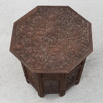 A carved table, first half of the 20th Century.