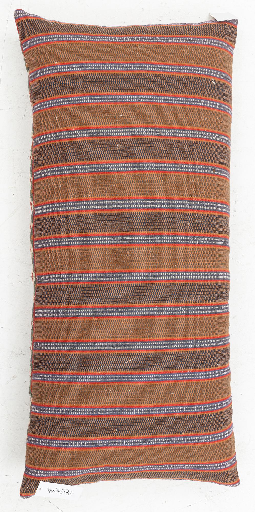 A flat weave Scania carriage cushion, late 19th Century, c. 115 x 55 cm.