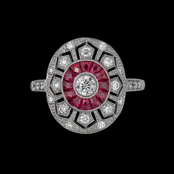 972. A diamond 0.38cts and step-cut ruby 0.50ct ring.