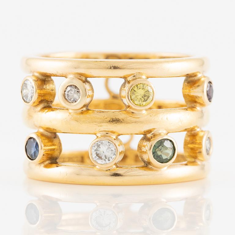 Ring 18K and 23K gold with diamonds in various colours.