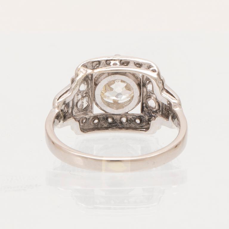 An 18K white gold ring set with an old cut diamond and rose cut diamonds.