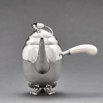 Georg Jensen, a three pieces coffee and tea service, "Blossom", Copenhagen Denmark 1915-21 830/1000 silver. Design nr 2,