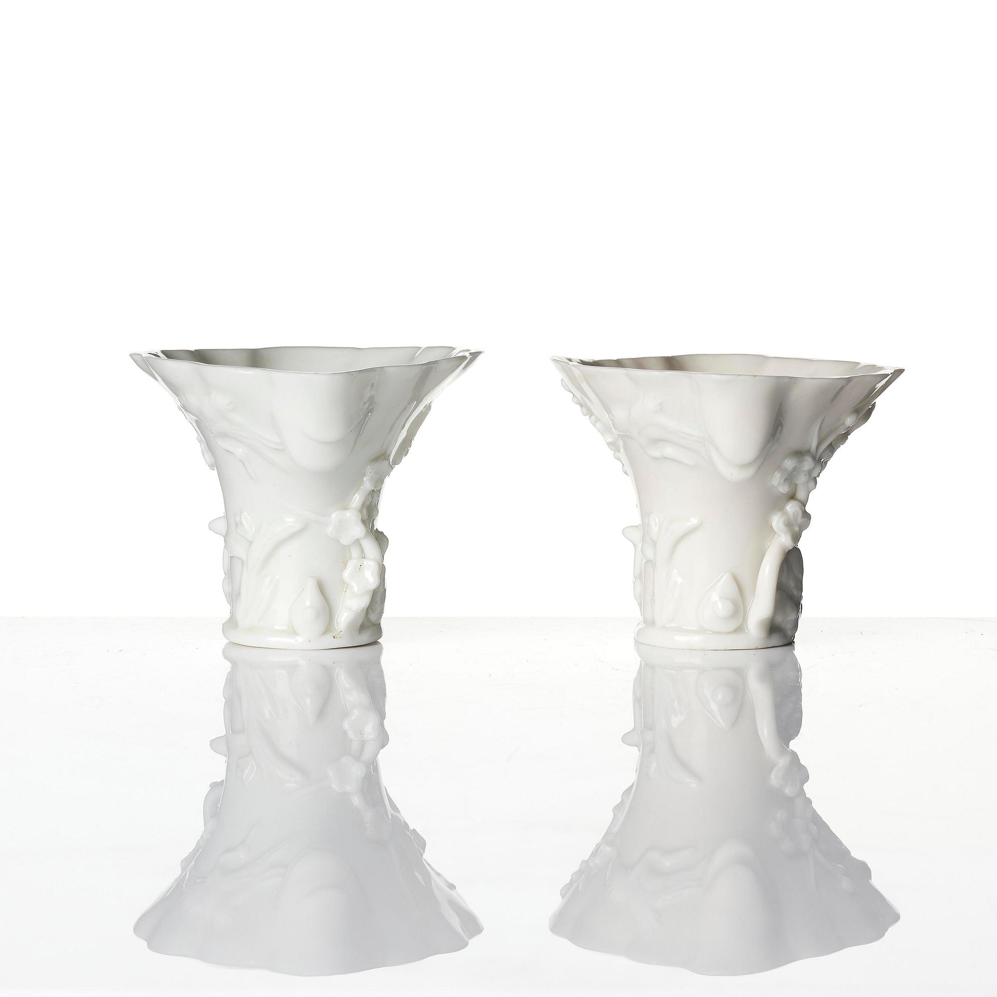 A pair of blanc de chine rhinoceros libation cups, Qing dynasty, Kangxi (1662-1722).