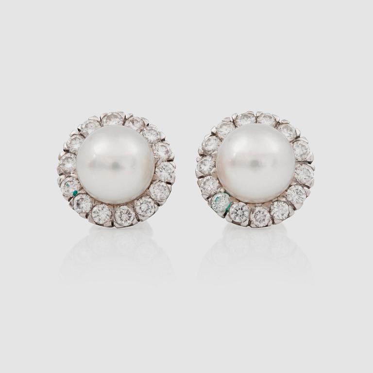 A pair of cultured pearl and diamond earrings. Diamond total carat weight circa 0.80 ct.