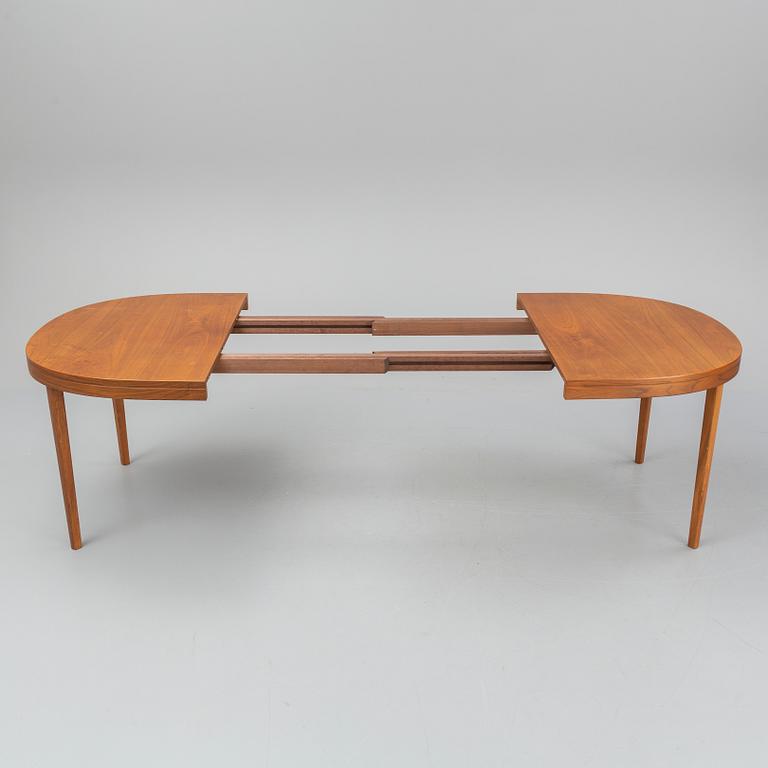 A walnut veneer table from the second half of the 20th century.