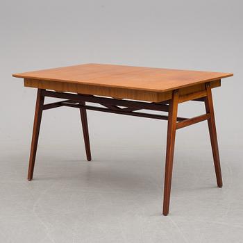 A teak veneered dining table, 1950's/60's.