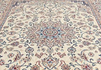 A carpet, Nain, part silk S.K 9LAA. Circa 352x248 cm.