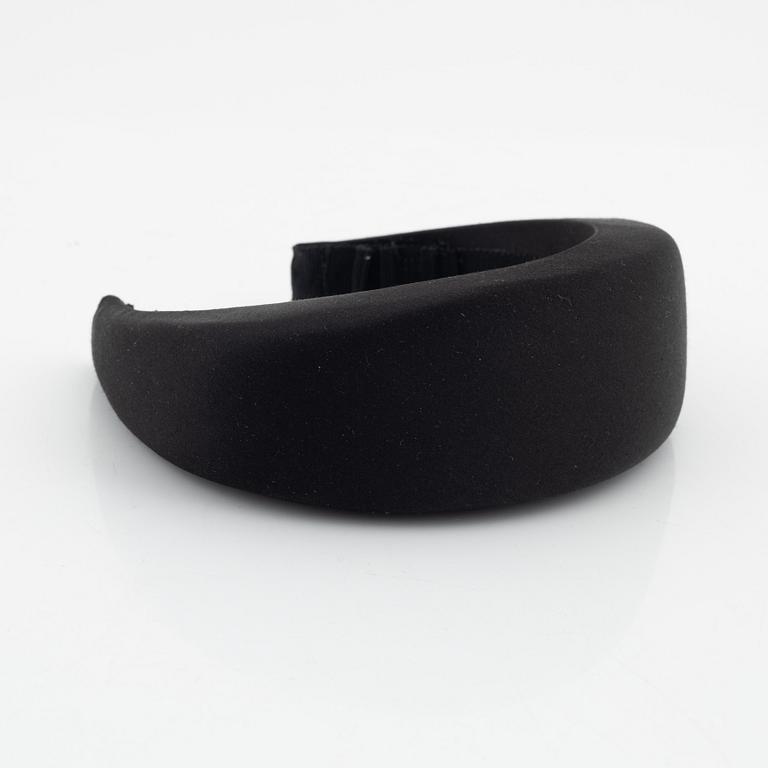 Prada, a black silk hair accessory.