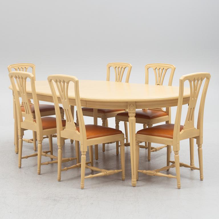 A Gustavian style dining table with six dining chairs, Sweden, 21st century.