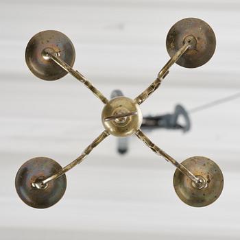 A four-branch baroque brass chandelier, late 17th century/circa 1700.