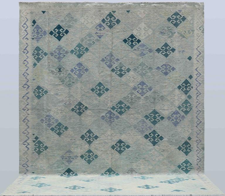 A Kilim carpet, c. 392 x 294 cm.