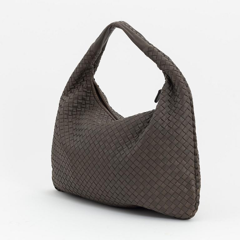 Bottega Veneta, a grey intrecciato leather bag.