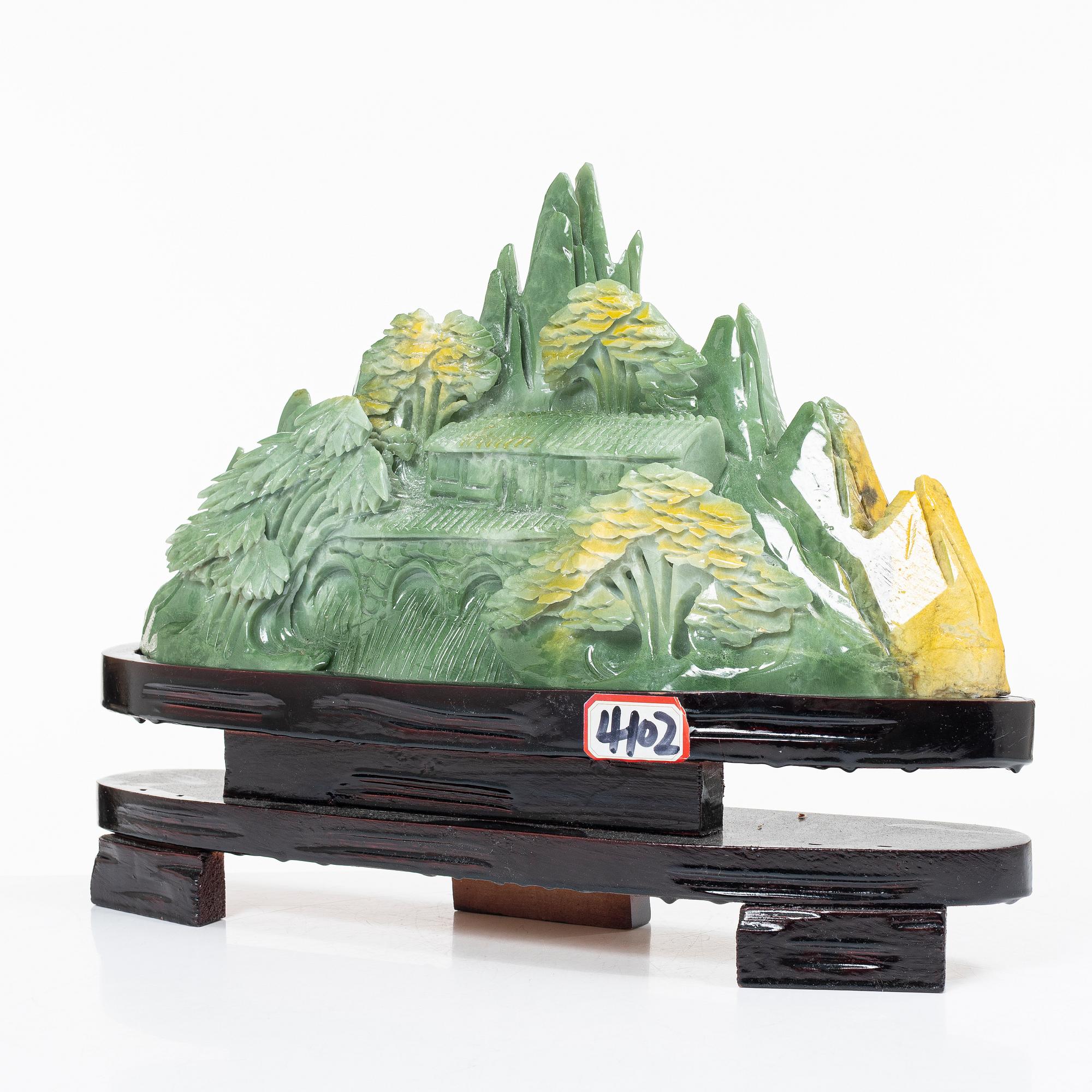 A serpentine jade csulptural carving, China, modern manufacturing.