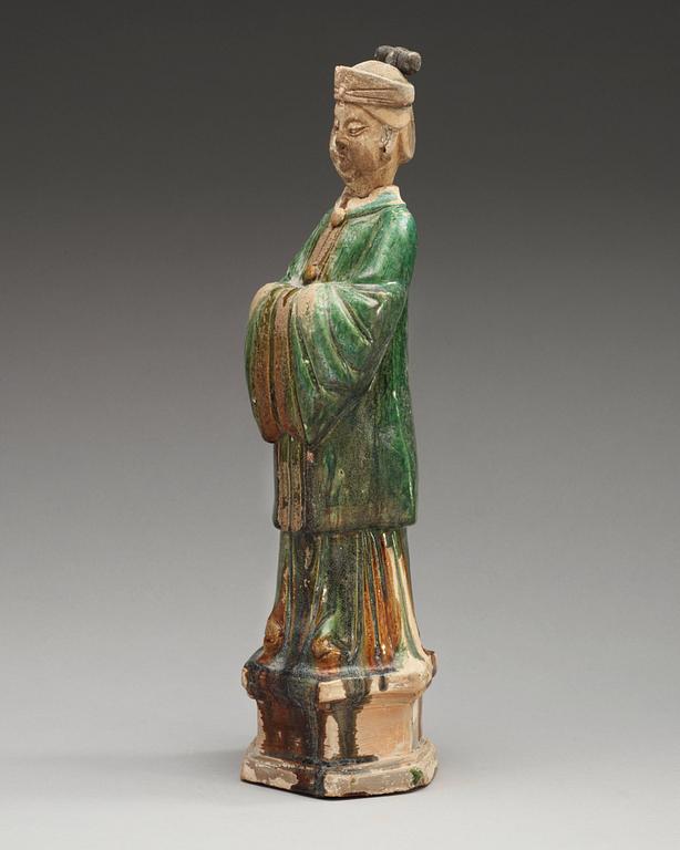 A green glazed pottery figure of a dignitary, Ming dynasty (1368-1644).