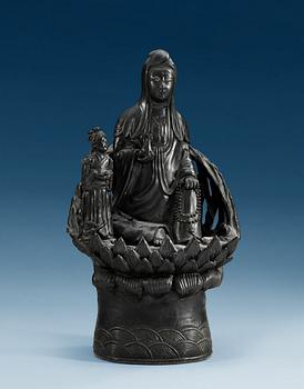 1514. A black figure of Guanyin, Qing dynasty.
