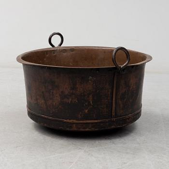 A 19th century copper cauldron.