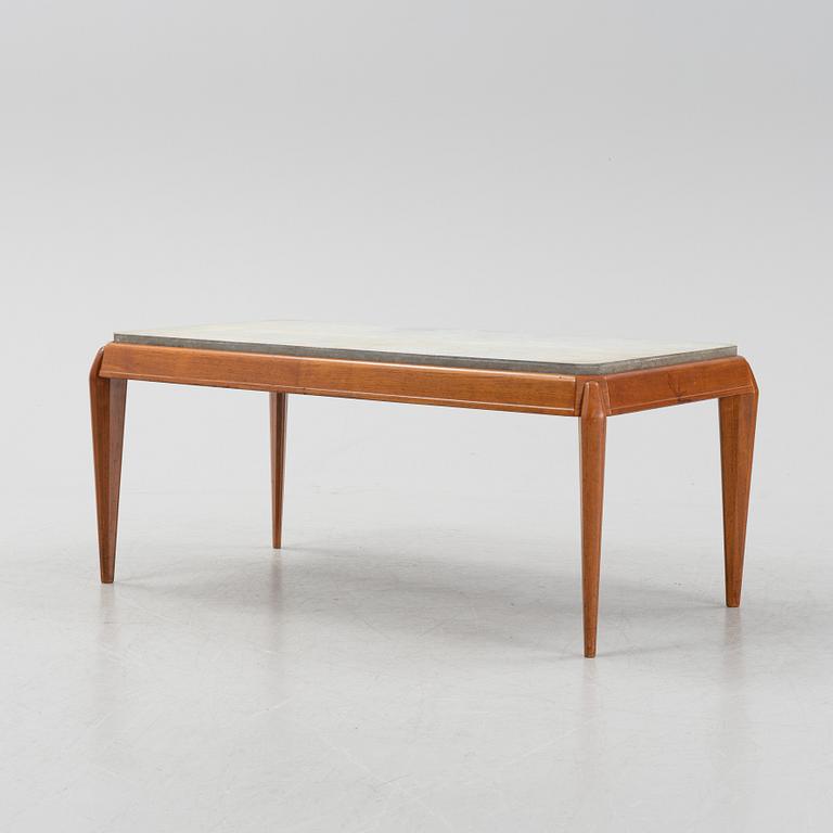 A mid 20th Century coffee table with a stone top.