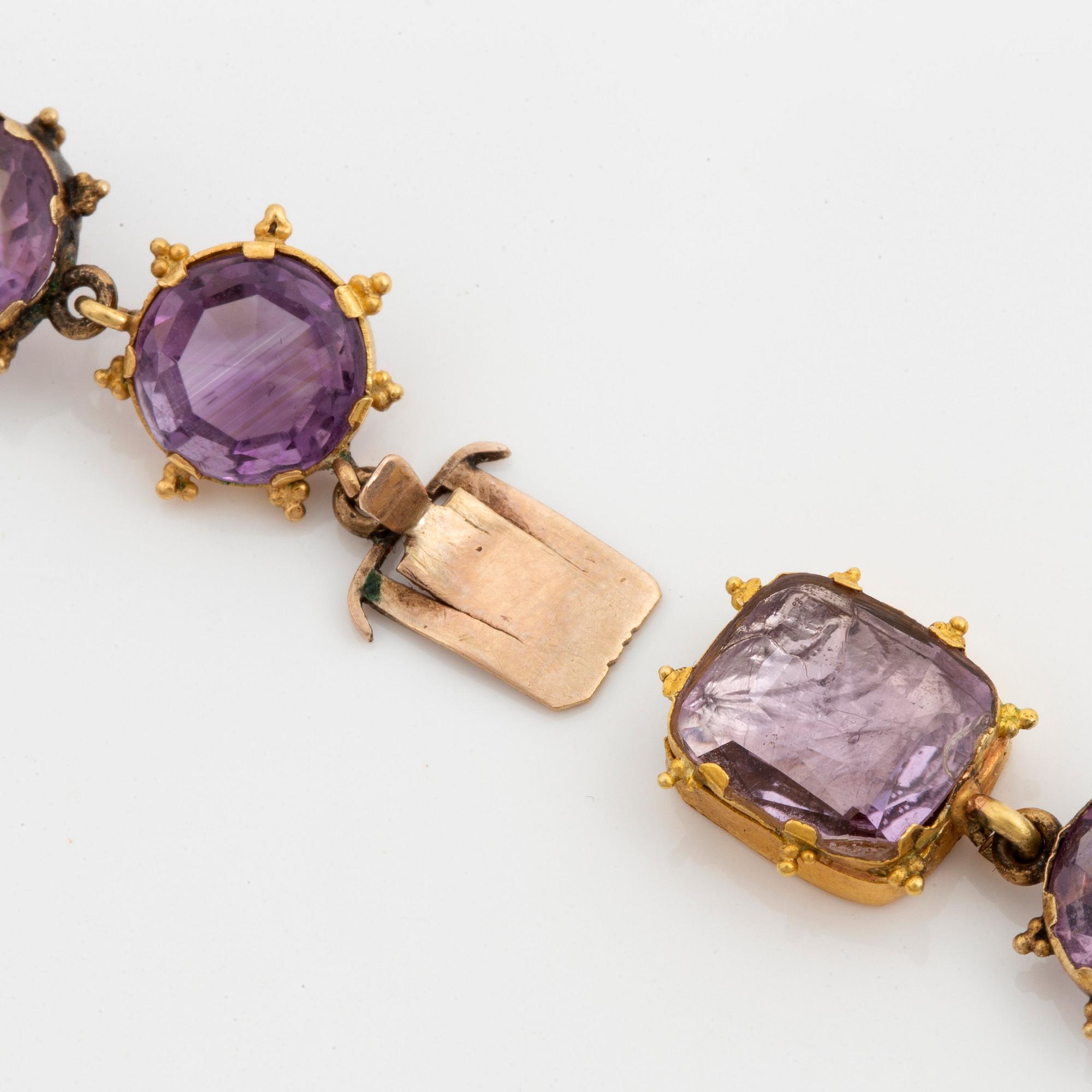 A 14K gold and amethyst necklace.