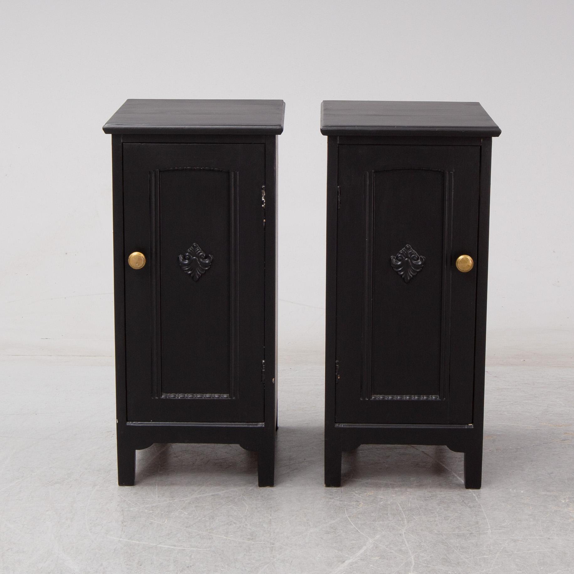 A pair of early 20th century bedside tables / cupboards.