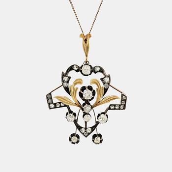 389. A 14K gold and silver pendant set with old- and rose-cut diamonds.