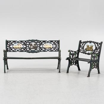 A children's cast iron garden sofa and armchair, mid 20th century.