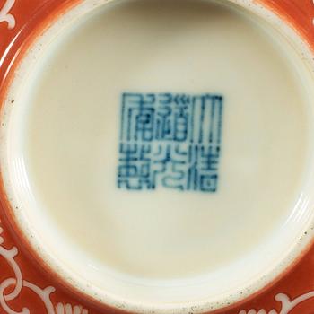 Two coral red ground bowls, late Qing dynasty, with Daoguang and Qianlong mark.