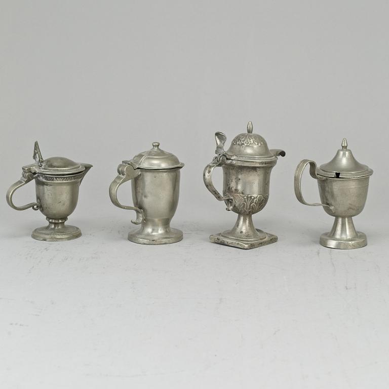 Eight pewter mustard pots, 18th/19th century.