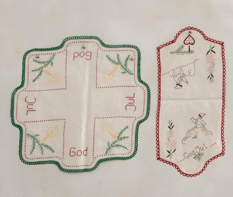 A collection of smaller Christmas tablecloths, runners, and wall hangings, approximately 34 pieces, mid/second half of the 20th century.