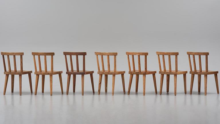 Axel Einar Hjorth, a set of seven stained pine "Utö" chairs, Nordiska Kompaniet, Sweden, 1930s.