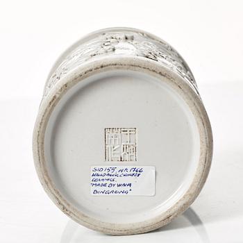 A white glazed Chinese brush pot, presumably late Qing dynasty.