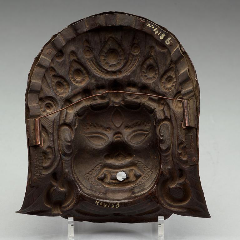 A copper alloy repousse mask, Nepal, presumably 17/18th Century.