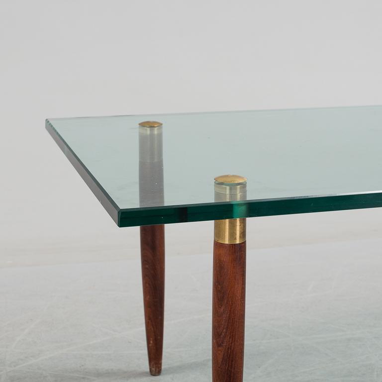 A 1960's glass sofa table.