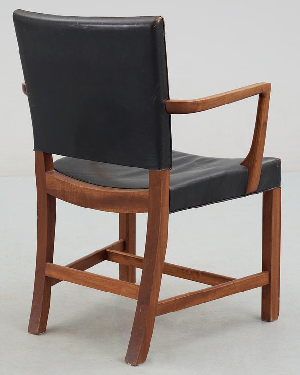 A Kaare Klint mahogany and black leather armchair by Rud Rasmussen snedkerier, Denmark.