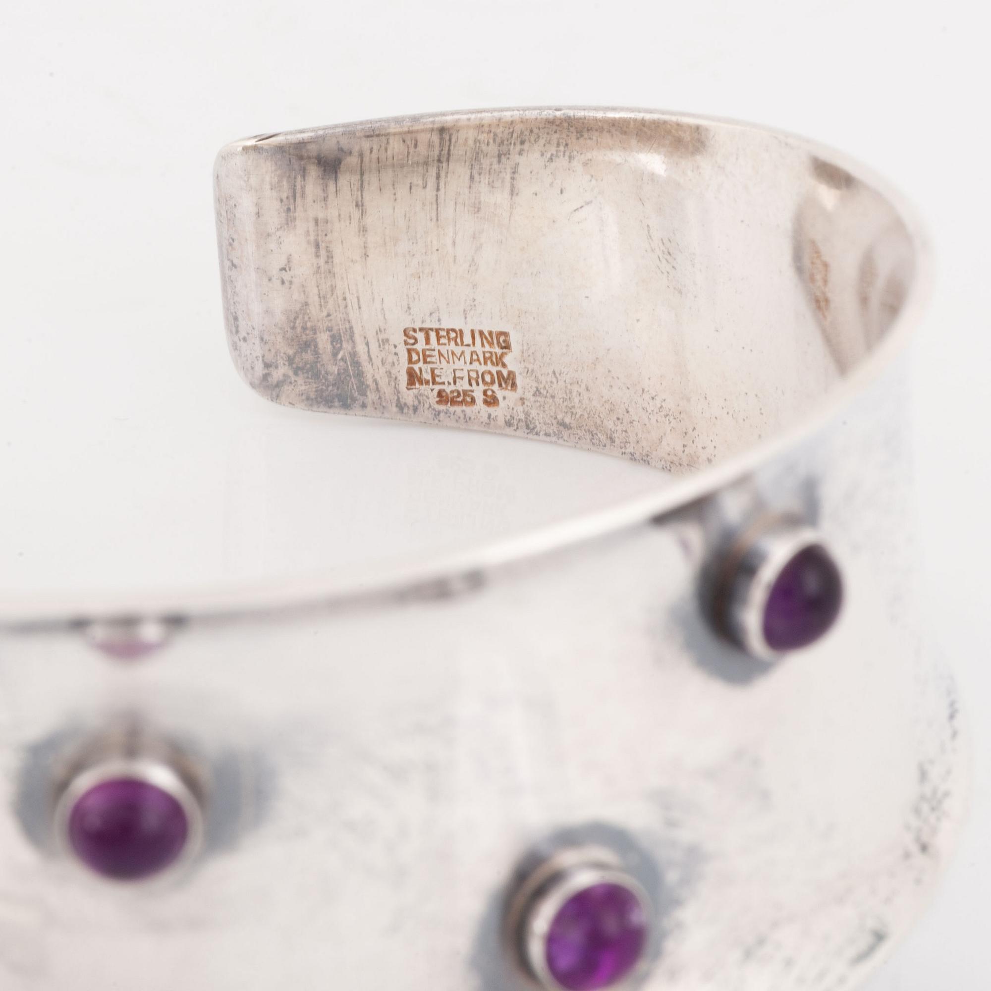 A silver and amethyst bracelet.