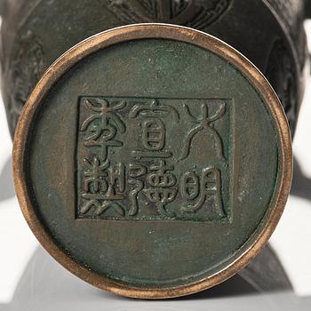 A bronze vase, late Qing dynasty with archaistic mark.