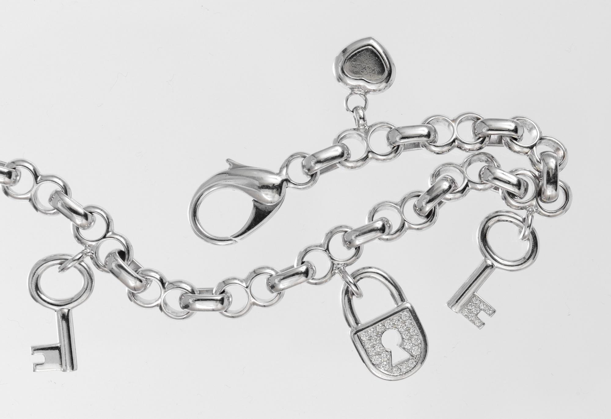 BRACELET, Chopard, five charms in the shape of heart, keys and locket.
