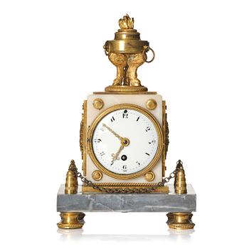 136. A French Louis XVI ormolu and marble mantel clock, late 18th century.