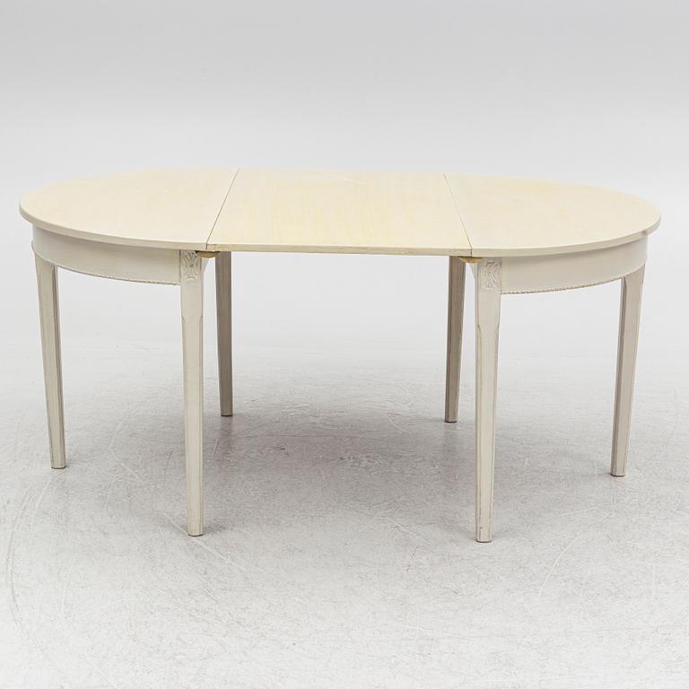 A Gustaivan style dining table/ two crescent shaped tables, end of the 19th century.