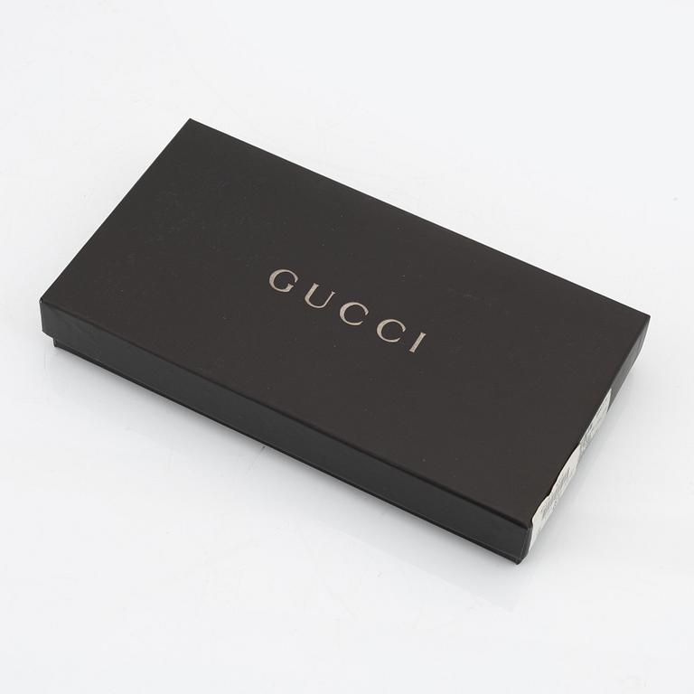 Gucci, a pair of black leather gloves, size 6 1/2.