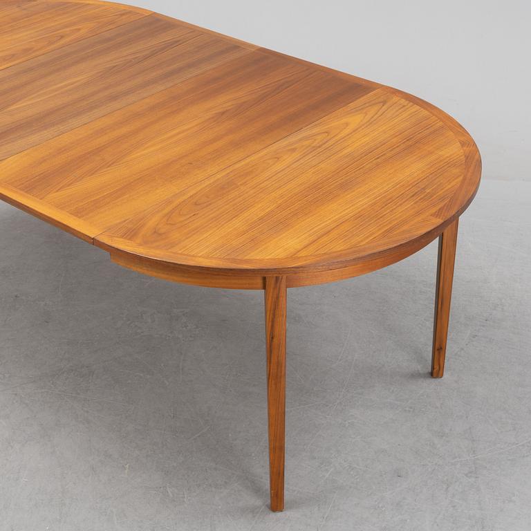 A teak veneered dining table, 1960's.