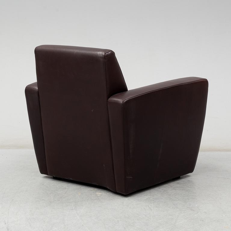 A contemporary brown leather easy chair from Moroso.