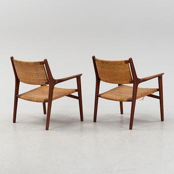 Hans J Wegner, a pair of teak and rattan "JH 516" easy chairs from Johannes Hansen, Denmark, 1950's/60's.